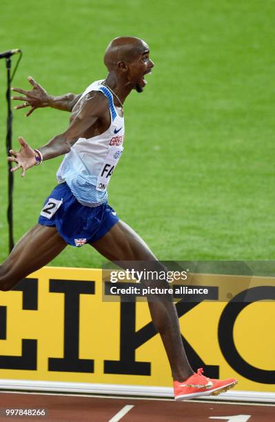 Mohammed "Mo" Farah from Great Britain celebrates his victory at the 10,000 meter run at the 2017 London World Championships in Athletics at the...