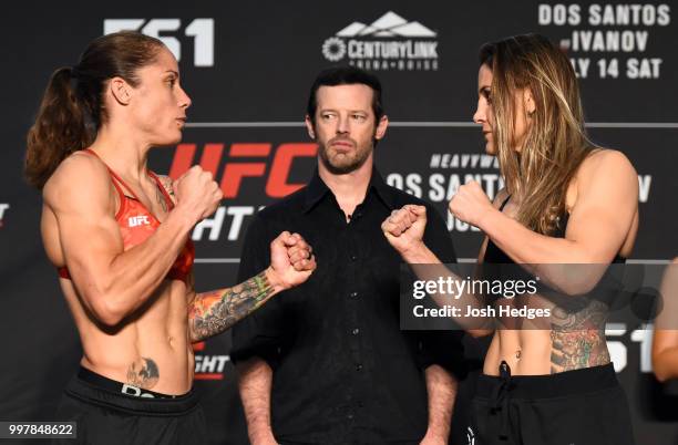 Opponents Liz Carmouche and Jennifer Maia of Brazil face off during the UFC Fight Night weigh-in at The Grove Hotel on July 13, 2018 in Boise, Idaho.