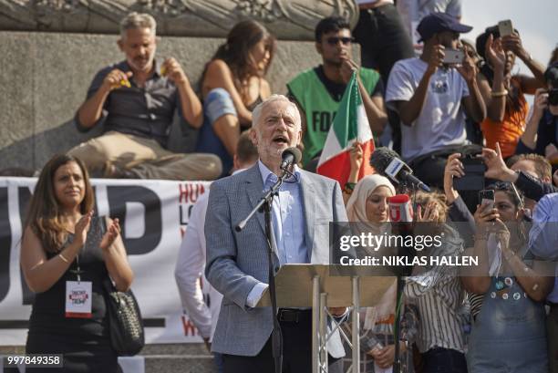Britain's opposition Labour Party leader Jeremy Corbyn gestures to the crowd in Trafalgar Square as protesters against the UK visit of US President...
