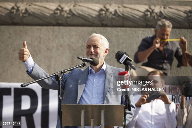 Britain's opposition Labour Party leader Jeremy Corbyn gestures to the crowd in Trafalgar Square as protesters against the UK visit of US President...