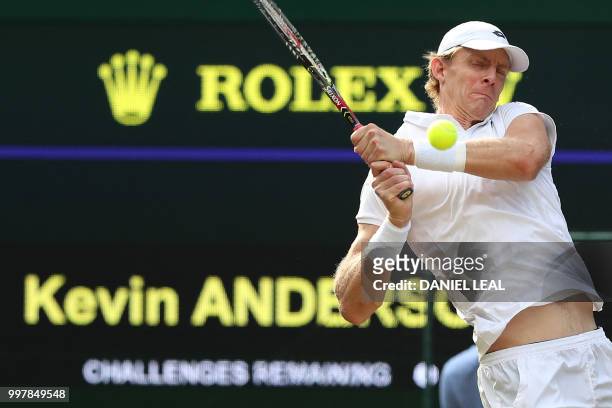 South Africa's Kevin Anderson returns against US player John Isner during the final set tie-break of their men's singles semi-final match on the...