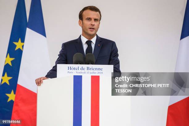 French President Emmanuel Macron delivers a speech after signing the annual armed forces annual law budget at the Hotel de Brienne in Paris, on July...