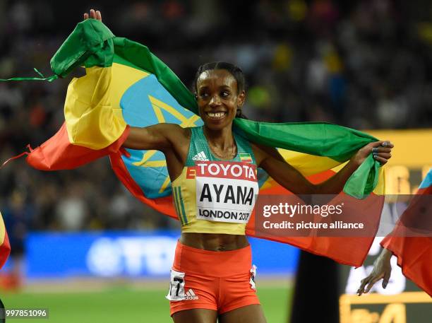 Almaz Ayana from Ethiopia celebrates her victory at the women's 10,000 meter run at the IAAF World Championships in London, Great Britain, 5 August...