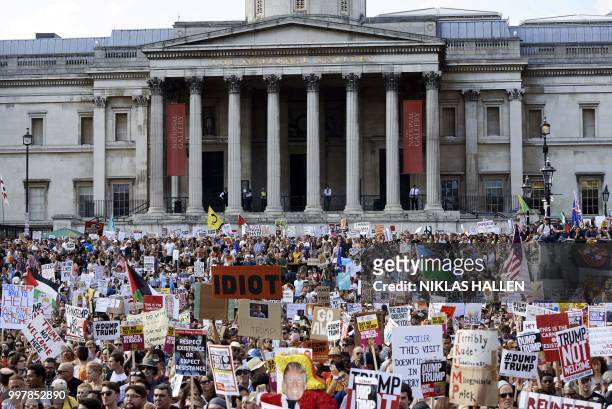 Protesters against the UK visit of US President Donald Trump gather in Trafalgar Square after taking part in a march in London on July 13, 2018. -...