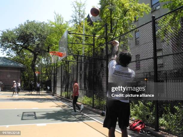 Basketball players play on the court that is devoted to killed rapper Notorious BIG in New York, United States, 04 August 2017. Photo: Johannes...