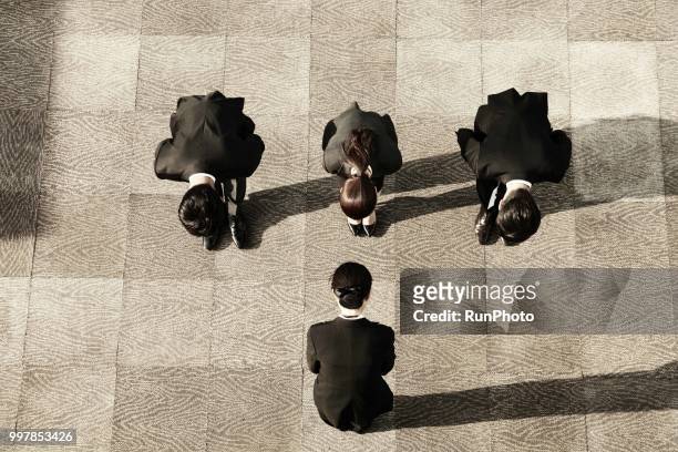 top view of business people bowing - japanese respect stock pictures, royalty-free photos & images