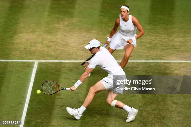 Jamie Murray of Great Britain and Victoria Azarenka of Belarus return against Jay Clarke and Harriet Dart of Great Britain during their Mixed Doubles...