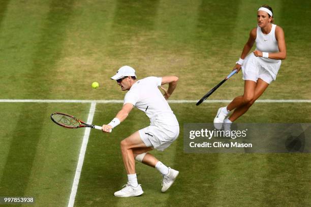 Jamie Murray of Great Britain and Victoria Azarenka of Belarus return against Jay Clarke and Harriet Dart of Great Britain during their Mixed Doubles...