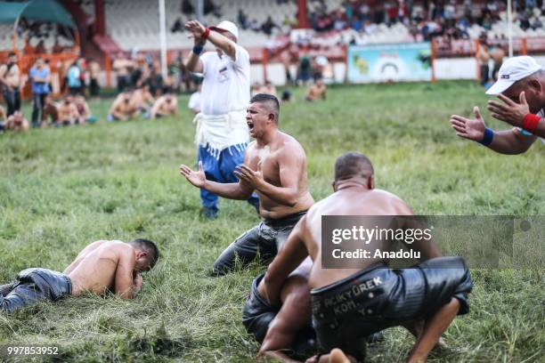 Wrestlers compete against each other on the first day of the 657th annual Kirkpinar Oil Wrestling Festival in Sarayici near Edirne, Turkey on July...