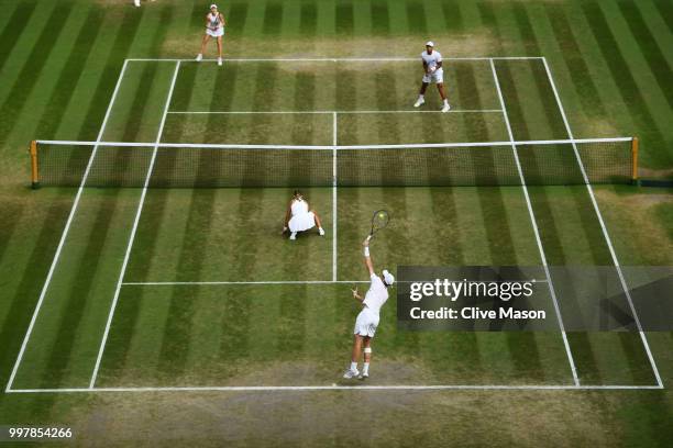 Jamie Murray of Great Britain and Victoria Azarenka of Belarus serve against Jay Clarke and Harriet Dart of Great Britain during their Mixed Doubles...