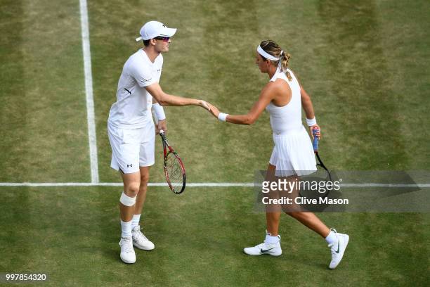 Jamie Murray of Great Britain and Victoria Azarenka of Belarus celebrate a point against Jay Clarke and Harriet Dart of Great Britain during their...