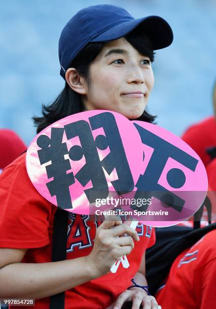 Fans in the stands on the third base side before the start off a game between the Seattle Mariners and the Los Angeles Angels of Anaheim played on...