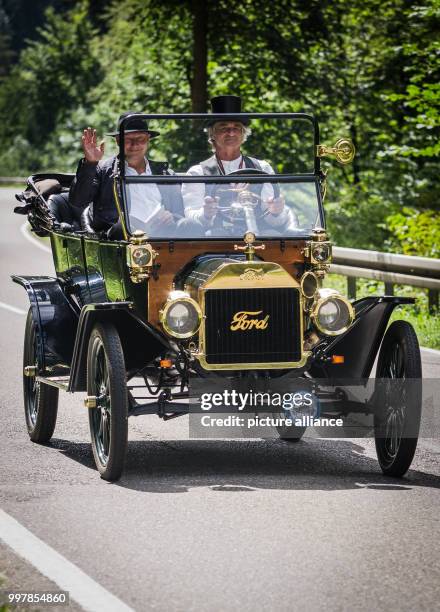 Participants in the large Ford Model T classic car ride drive through a street near to Bad Teinach-Zavelstein, Germany, 05 August 2017. Photo:...