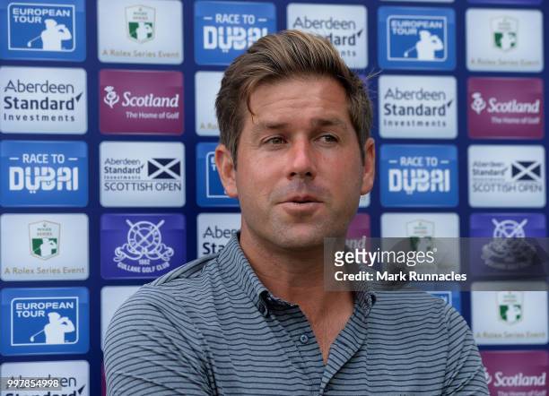 Robert Rock of England speaks with the media during the second day of the Aberdeen Standard Investments Scottish Open at Gullane Golf Course on July...