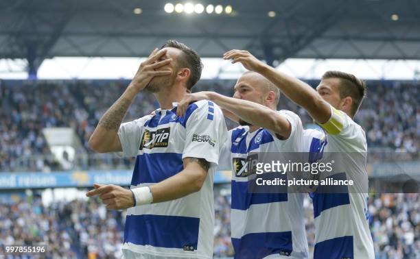 Dpatop - Duisburg's Borys Taschtschi , Simon Brandstetter and Kevin Wolze celebrating the 1:0 during the 2nd Bundesliga match pitting MSV Duisburg vs...