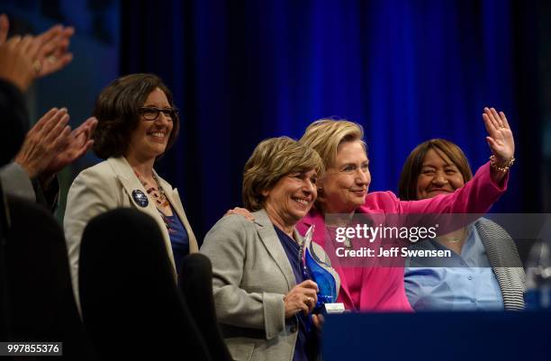 Former Secretary of State Hillary Clinton waves to the audience at the annual convention of the American Federation of Teachers Friday, July 13, 2018...