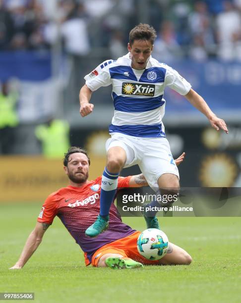 Bochum's Tim Hoogland and Duisburg's Fabian Schnellhardt vie for the ball during the 2nd Bundesliga match pitting MSV Duisburg vs VfL Bochum at the...