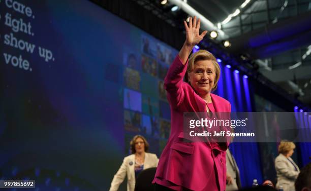 Former Secretary of State Hillary Clinton waves to the audience after speaking at the annual convention of the American Federation of Teachers...