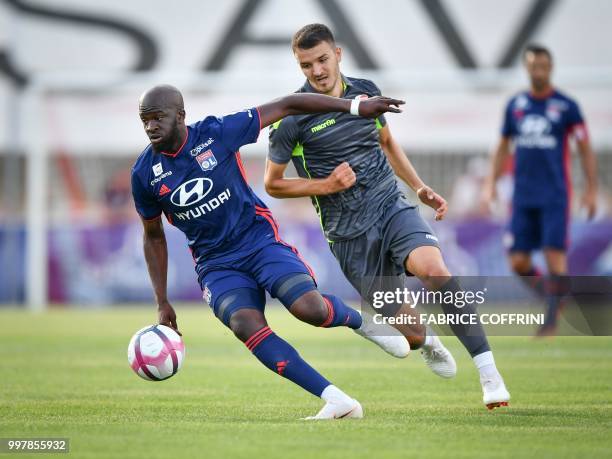 Lyon's French midfielder Tanguy Ndombele and FC Sion's Swiss midfielder Anto Grgic vies for the ball during a friendly football match between FC Sion...