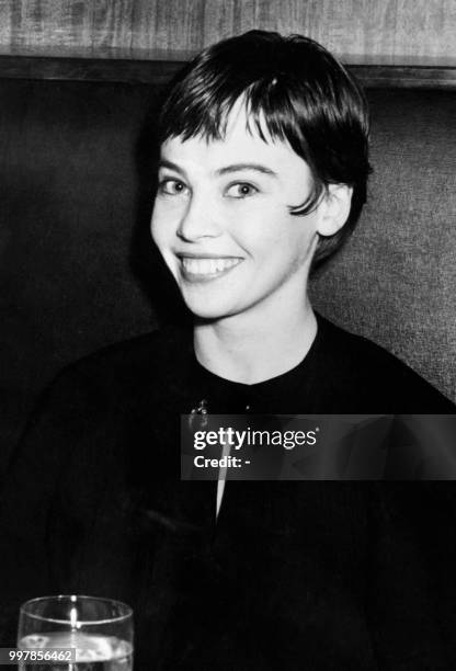 Franco-American actress Leslie Caron poses in a restaurant in the 60s.