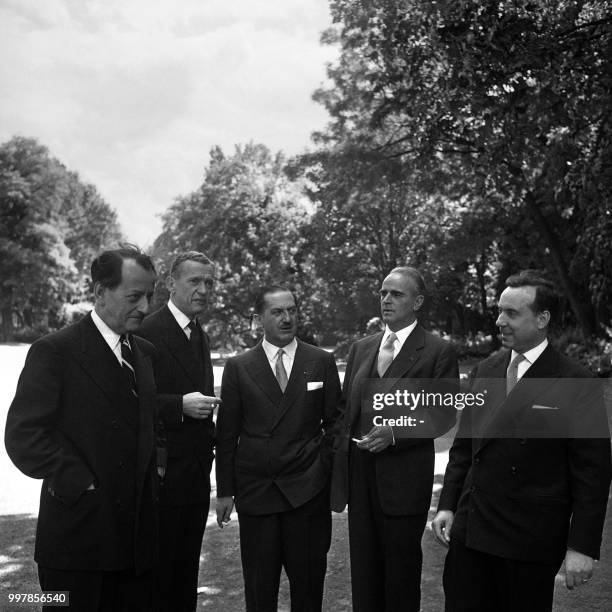 Greek prime minister Konstantinos Karamanlis poses with André Malraux , France's first Minister of Cultural Affairs, Maurice Couve de Murville ,...