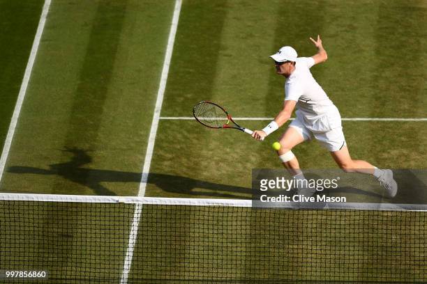 Jamie Murray of Great Britain returns against Jay Clarke and Harriet Dart of Great Britain during his Mixed Doubles semi-final match on day eleven of...