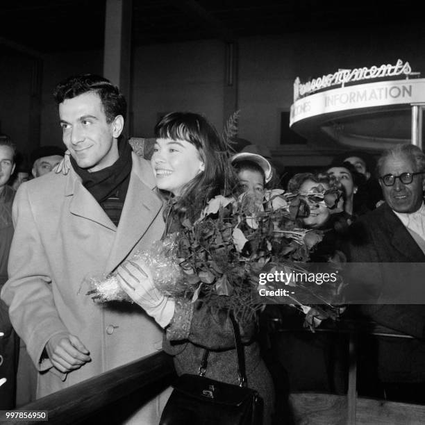 Franco-American actress Leslie Caron is welcomed by French dancer and choreographer Roland Petit at Orly airport, on October 26, 1953.