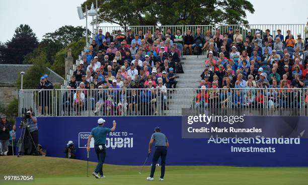 Justin Rose of England and Rickie Fowler of USA finish their round at 18 green during the second day of the Aberdeen Standard Investments Scottish...