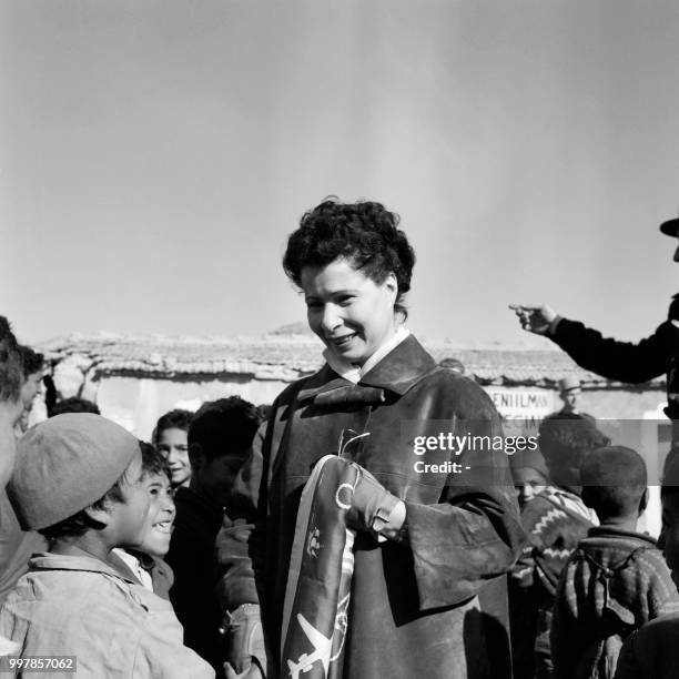 French politician Nafissa Sid Cara talks with children in an unlocated place in Algeria in the 60's. - Nafissa Sid Cara was a French politician....