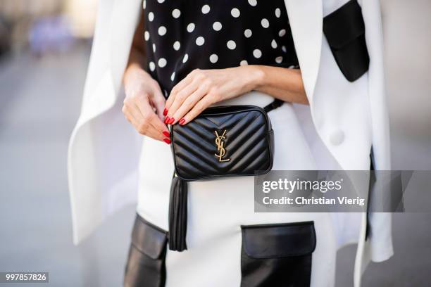 Alexandra Lapp is seen wearing a white Crepe blazer with black leather utility pockets and a white Crepe skirt with black leather utility pockets by...