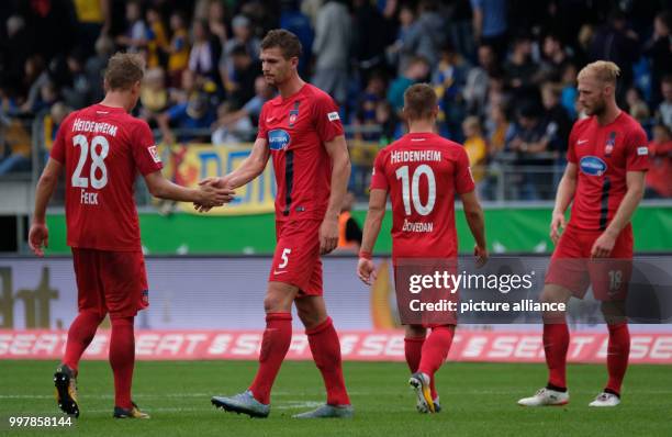 Heidenheim's Arne Feick , Mathias Wittek, Nikola Dovedan and Sebastian Griesbeck pictured on the pitch after the 2nd Bundesliga match pitting...