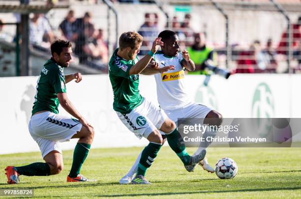 Ibrahima Traore of Borussia Moenchengladbach battle for the ball during the preseason friendly match between VfB Luebeck and Borussia...