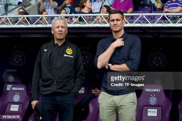 Head coach Lucien Favre of Dortmund and Head of the Licensing Player Department Sebastian Kehl of Dortmund look on prior to the friendly match...