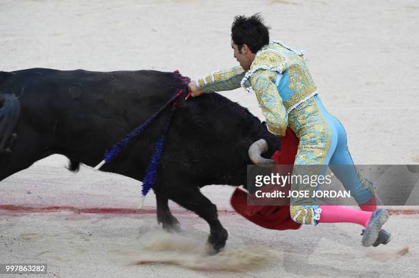 Spanish matador Cayetano Rivera stabs a Jandilla fighting bull during a bullfight of the San Fermin festival in Pamplona, northern Spain on July 13,...