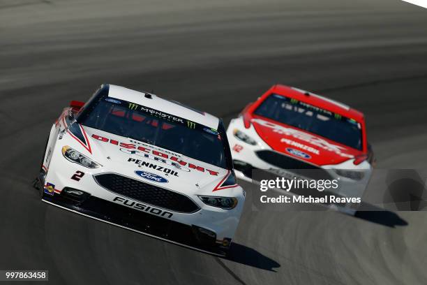 Brad Keselowski, driver of the Discount Tire Ford, practices for the Monster Energy NASCAR Cup Series Quaker State 400 presented by Walmart at...