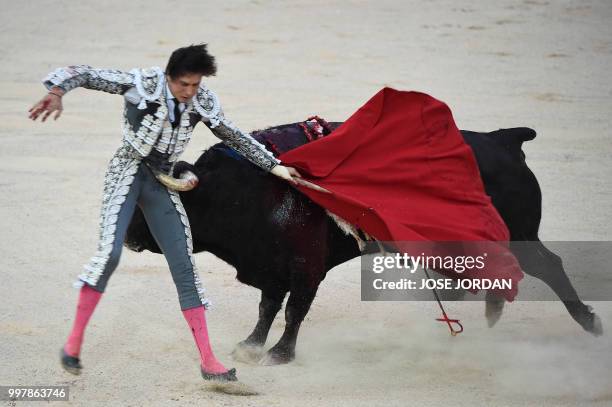 Spanish matador Andres Roca Rey is tossed by a Jandilla fighting bull during a bullfight of the San Fermin festival in Pamplona, northern Spain on...