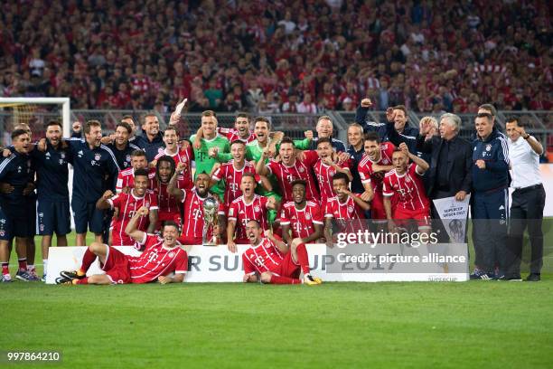The Bayern Munich posing for the official victory picture after the award ceremony of the FC Bayern Munich vs Borussia Dortmund supercup final in the...