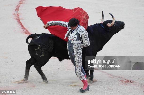 Spanish matador Andres Roca Rey performs a pass on a Jandilla fighting bull during a bullfight of the San Fermin festival in Pamplona, northern Spain...