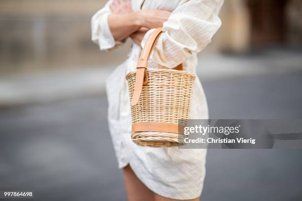 Alexandra Lapp is seen wearing beige striped La Robe Bolso dress by Jacquemus, Maureen leather mules in leo print from Malone Soulless, L'osier sand...