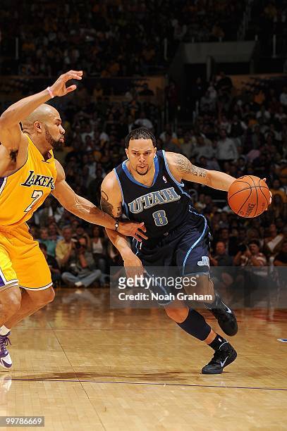 Deron Williams of the Utah Jazz drives against Derek Fisher of the Los Angeles Lakers in Game Two of the Western Conference Semifinals during the...