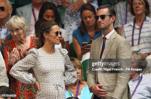 Pippa and James Matthews on centre court on day eleven of the Wimbledon Championships at the All England Lawn Tennis and Croquet Club, Wimbledon.