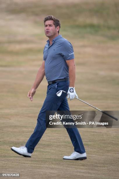 Robert Rock keeps an eye on his approach shot at the 16th during day two of the Aberdeen Standard Investments Scottish Open at Gullane Golf Club,...