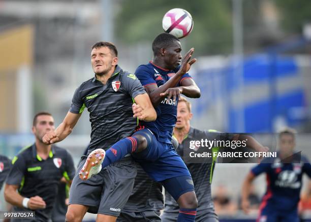 Lyon's Senegalese midfielder Diop Pape Cheikh and FC Sion's Swiss midfielder Anto Grgic vie for the ball during the friendly football match between...