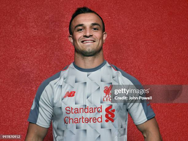 Xherdan Shaqiri signs for Liverpool at Melwood Training Ground on July 13, 2018 in Liverpool, England.