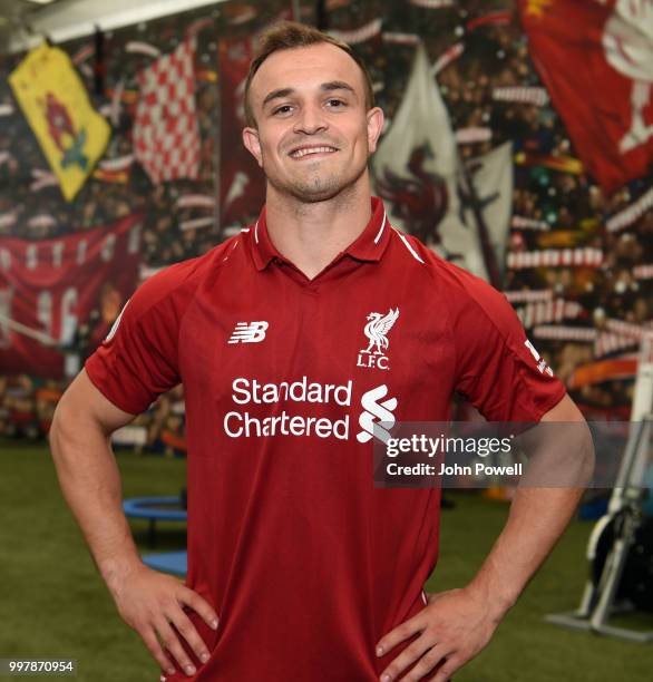 Xherdan Shaqiri signs for Liverpool at Melwood Training Ground on July 13, 2018 in Liverpool, England.