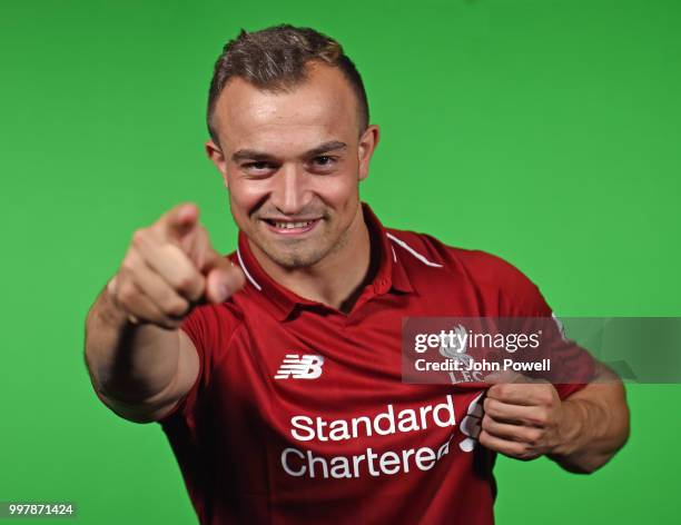 Xherdan Shaqiri signs for Liverpool at Melwood Training Ground on July 13, 2018 in Liverpool, England.