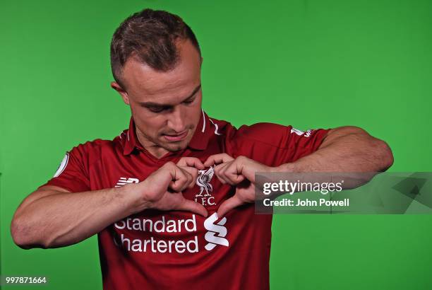 Xherdan Shaqiri signs for Liverpool at Melwood Training Ground on July 13, 2018 in Liverpool, England.