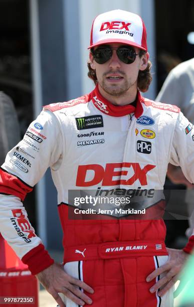 Ryan Blaney, driver of the DEX Imaging Ford, stands in the garage area during practice for the Monster Energy NASCAR Cup Series Quaker State 400...