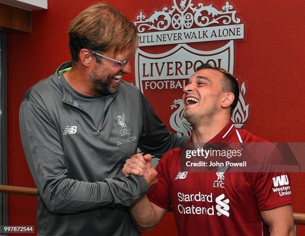 Xherdan Shaqiri with his new boss Jurgen Klopp manager of Liverpool signs for Liverpool at Melwood Training Ground on July 13, 2018 in Liverpool,...