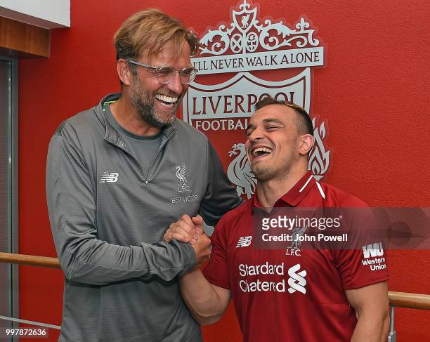 Xherdan Shaqiri with his new boss Jurgen Klopp manager of Liverpool signs for Liverpool at Melwood Training Ground on July 13, 2018 in Liverpool,...